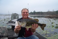 Stan holding a big bass, Monticello, Arkansas, March '06
